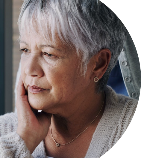 concerned woman looking out window